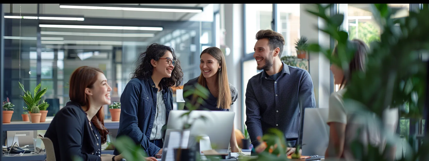 Why Small Businesses Leverage Fortune 500 Corporate-grade Benefits to Attract Top Talent 1 a group of employees smiling and working together in a modern office space.