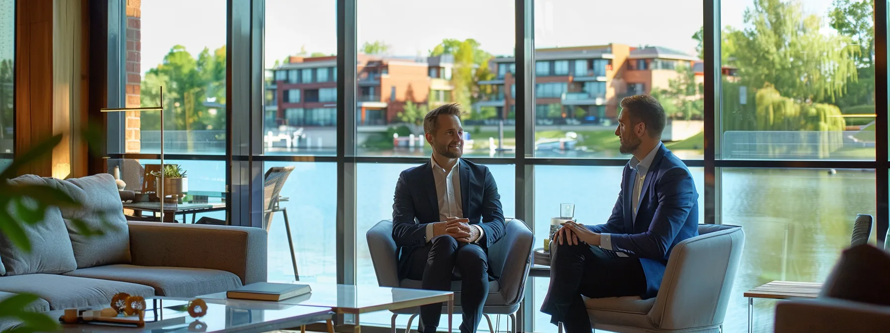 How Investing in Luxury Lakefront Homes in Pike County Transforms Your Portfolio 2 business professionals engage in a strategic discussion in a modern office overlooking luxury lakefront homes.
