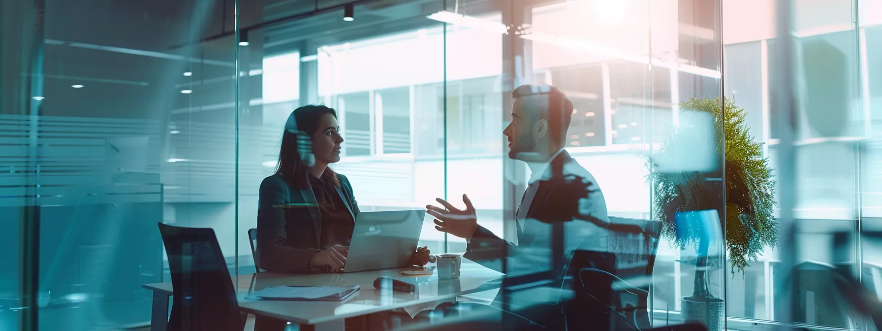 How Leveraging AI-Powered Marketing Solutions Drives Customer Retention 2 business professionals engage in a strategic discussion about ai-driven marketing solutions.