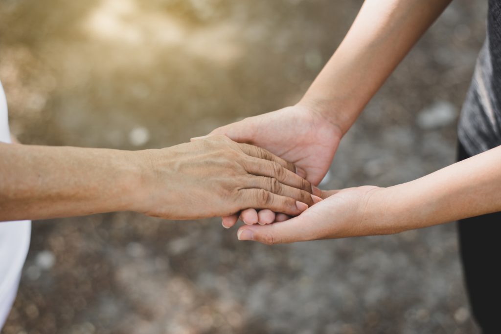 close-up of hands shaking
